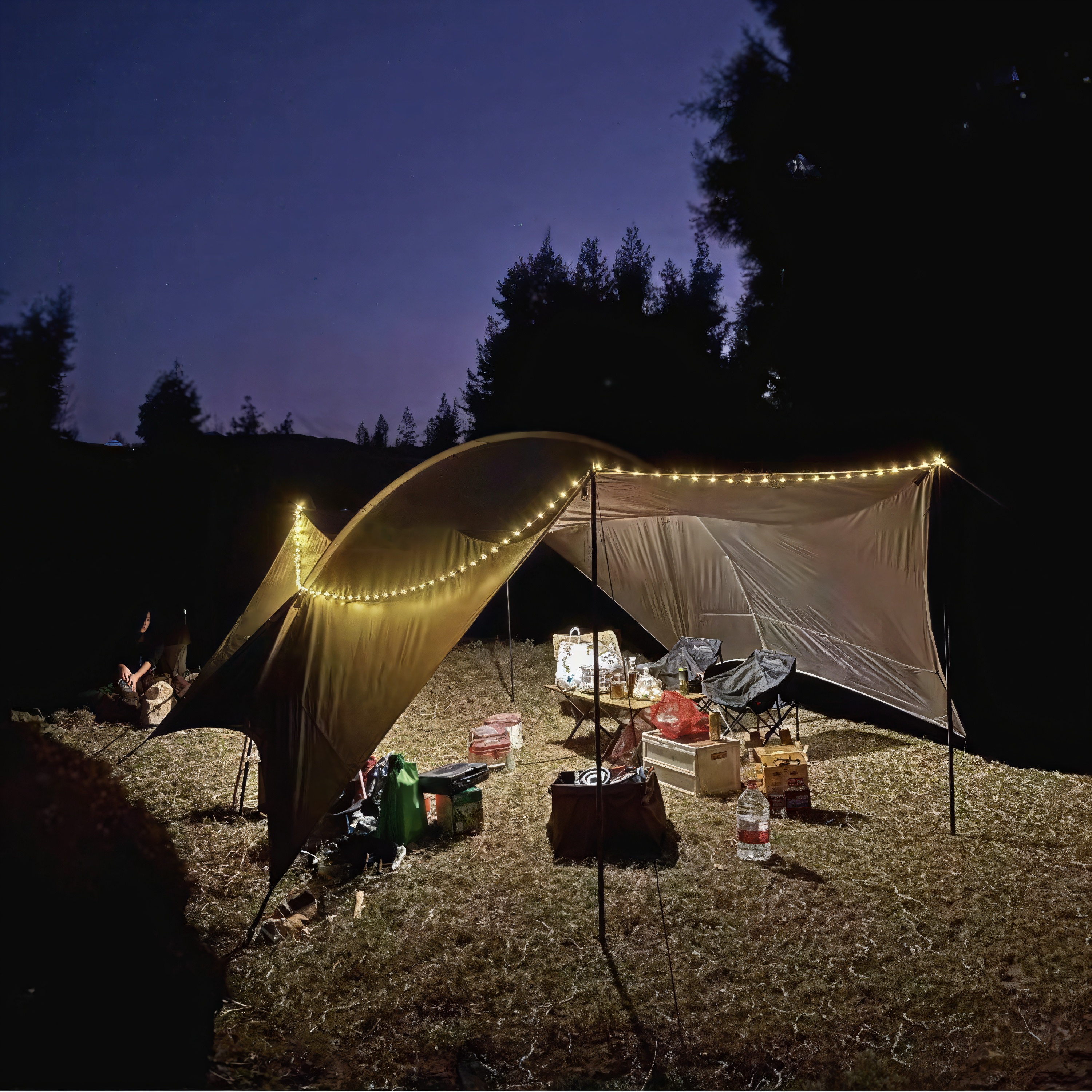 LED camping light illuminating tent at night