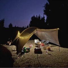 LED camping light illuminating tent at night